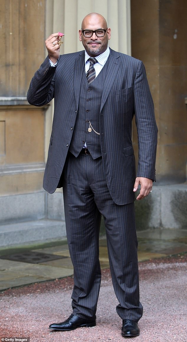 Twitter user Clementine Fandango, from Cardiff, complained to Amaechi Performance Systems, a Manchester-based consultancy firm, about former professional basketball player turned psychologist John Amaechi, 49. Pictured, receiving his OBE in 2011